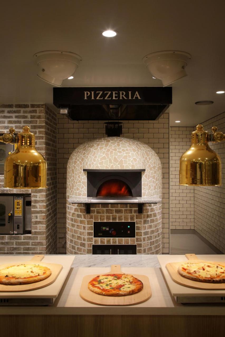 Asaya Hotel Нико Екстериор снимка Wood-fired oven